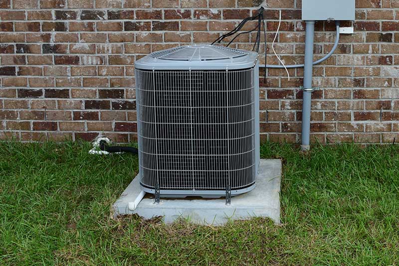 Outdoor AC unit serviced with a new capacitor in New Braunfels, TX