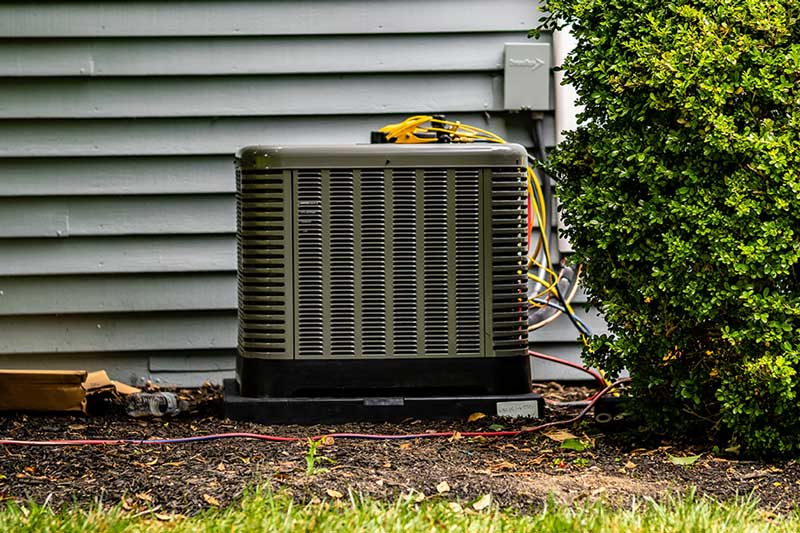 Professional AC tune up performed on an outdoor unit in New Braunfels, TX